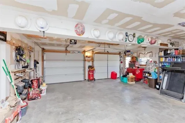 a view of a balcony with wooden floor & fence