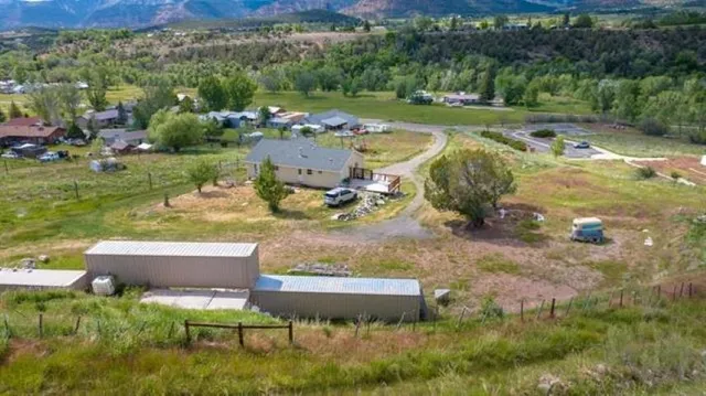 an aerial view of residential house with outdoor space