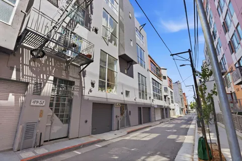 a view of a street with buildings