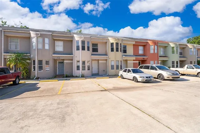 a view of a parked cars in front of a building