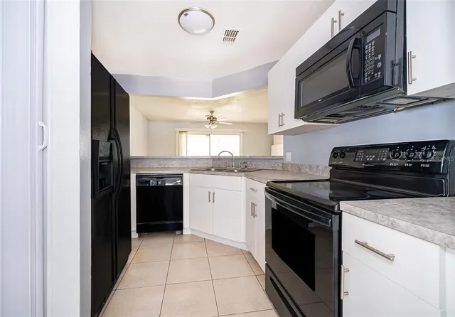 a kitchen with a stove and a microwave