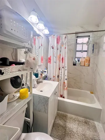 a bathroom with a sink a mirror and a shower