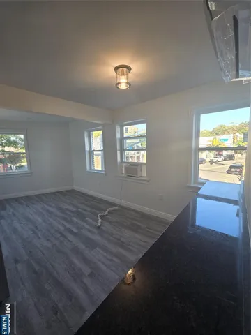 a view of empty room with windows