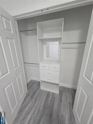 a view of an empty walk in closet