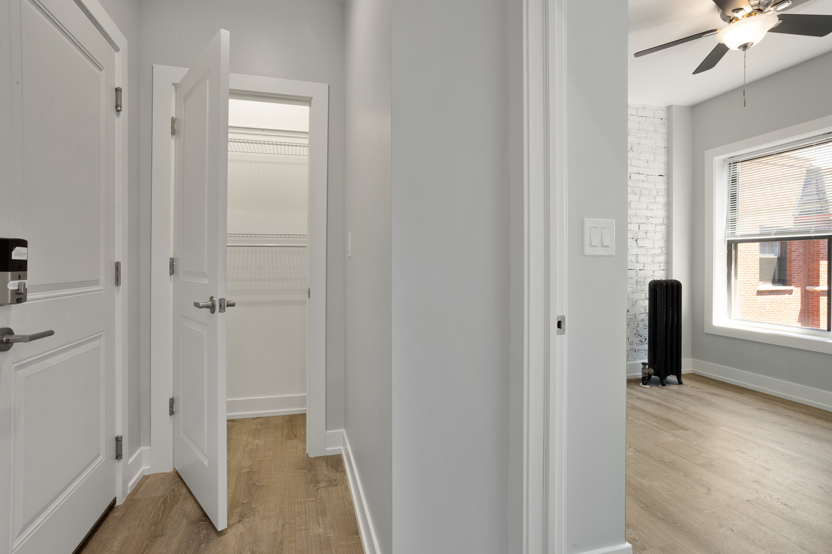 1704 West Juneway Terrace, Unit 3F Chicago, IL 60626 - Photo 6 of 13 a view of a hallway with windows and closet