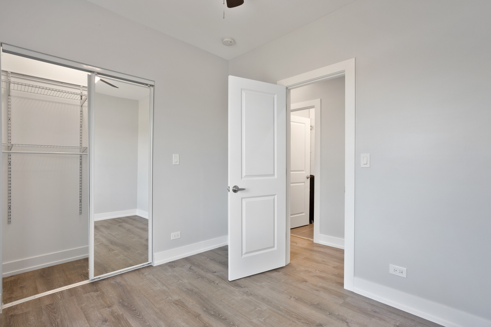 1704 West Juneway Terrace, Unit 3F Chicago, IL 60626 - Photo 8 of 13 a view of an empty room with wooden floor