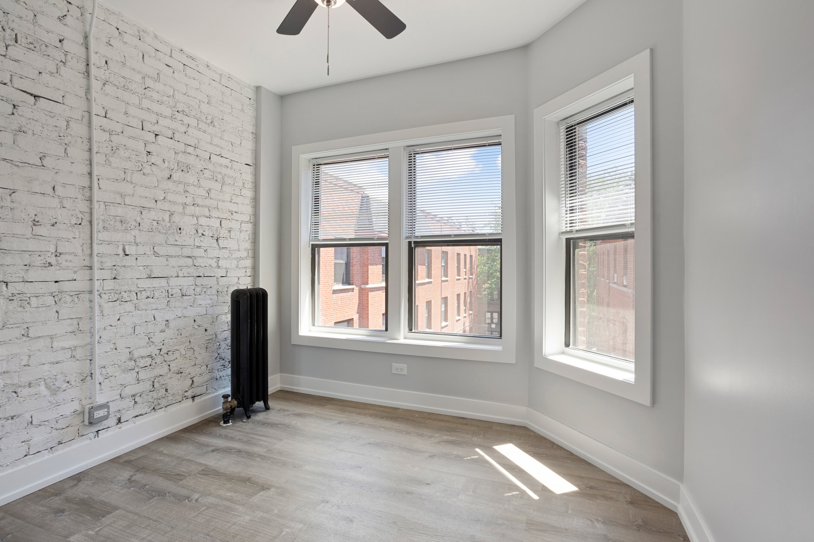 1704 West Juneway Terrace, Unit 3F Chicago, IL 60626 - Photo 9 of 13 an empty room with windows and closet