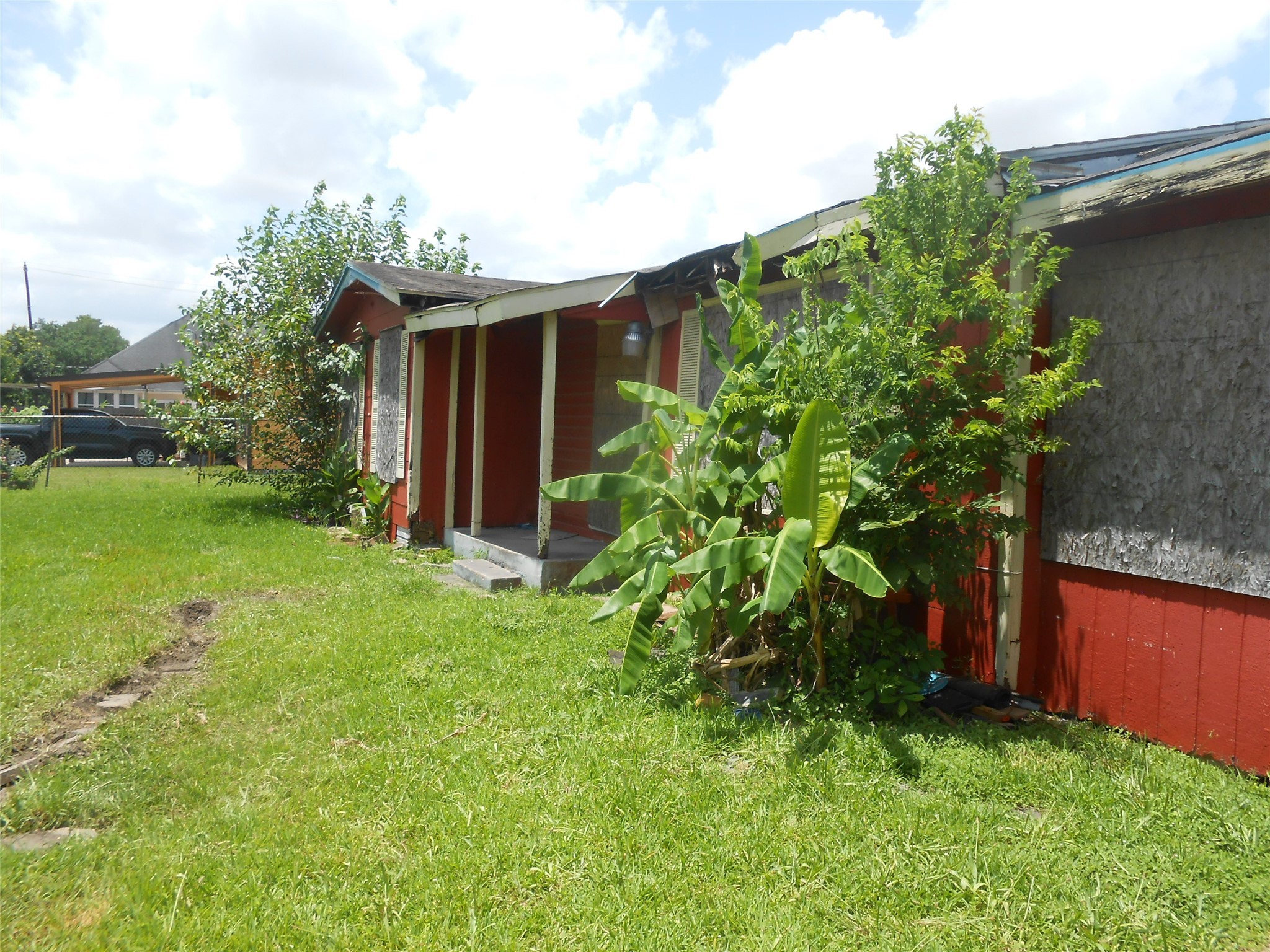 1118 Elberta Street Houston, TX 77051 - Photo 1 of 6 a view of backyard with potted plants and large tree