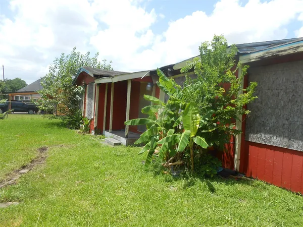 a backyard of a house with lots of green space