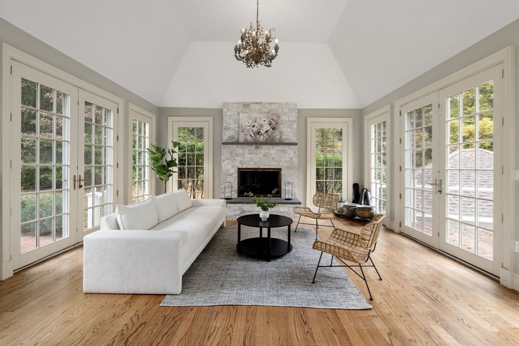 137 Lake Street Sherborn, MA 01770 - Photo 13 of 42 a living room with furniture and a fireplace