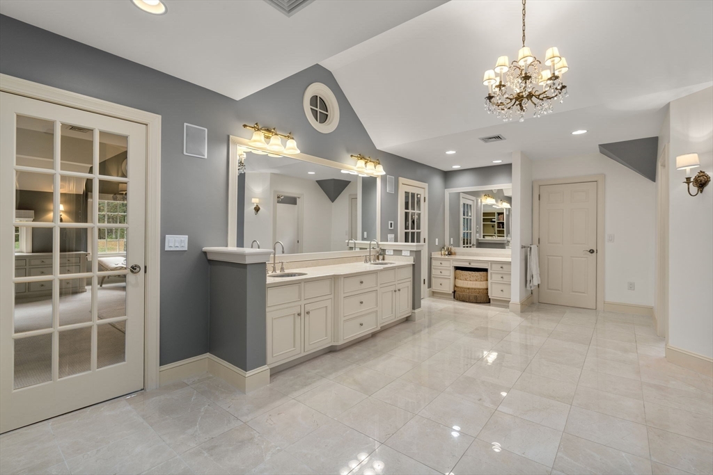 137 Lake Street Sherborn, MA 01770 - Photo 17 of 42 a large kitchen with a lot of cabinets and wooden floor
