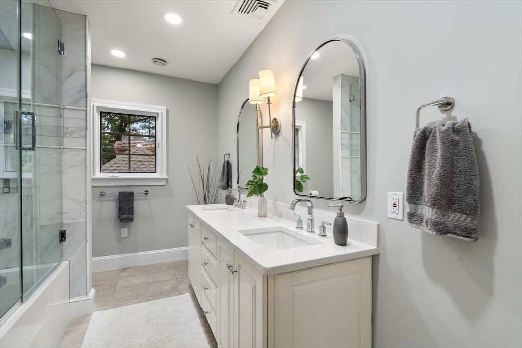137 Lake Street Sherborn, MA 01770 - Photo 20 of 42 a bathroom with a double vanity sink and a mirror