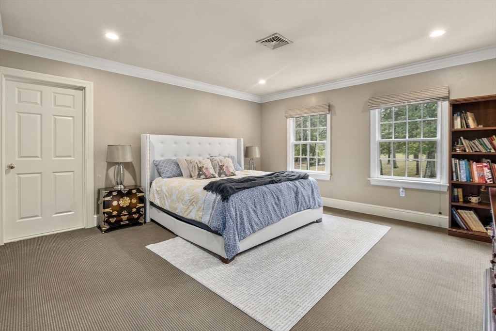 137 Lake Street Sherborn, MA 01770 - Photo 21 of 42 a bedroom with a bed and a window