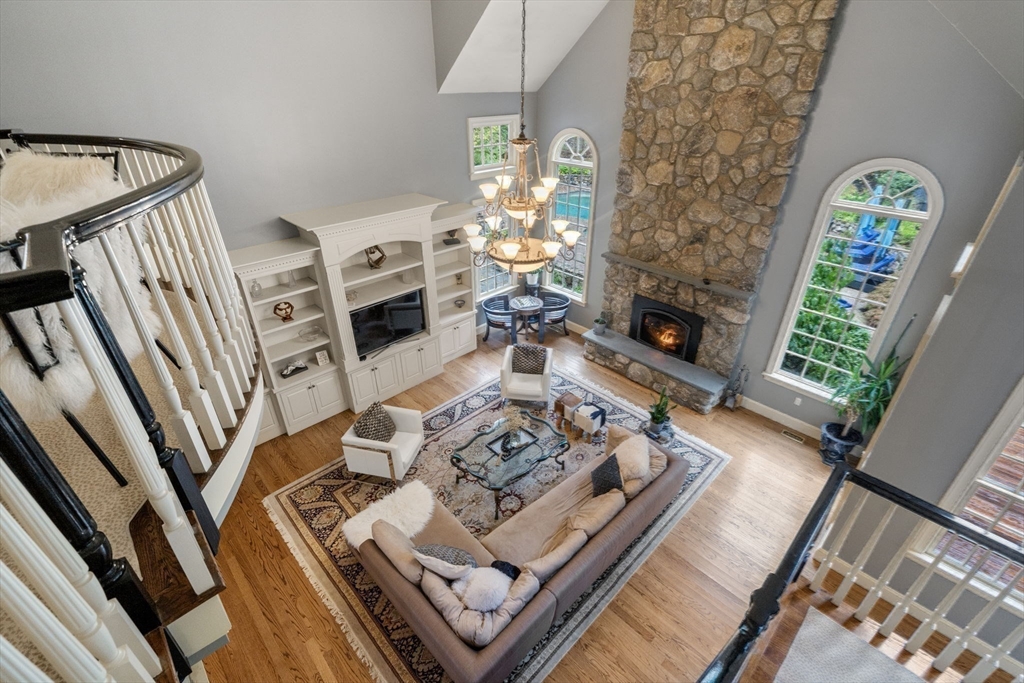 137 Lake Street Sherborn, MA 01770 - Photo 25 of 42 a living room with furniture fireplace and flat screen tv