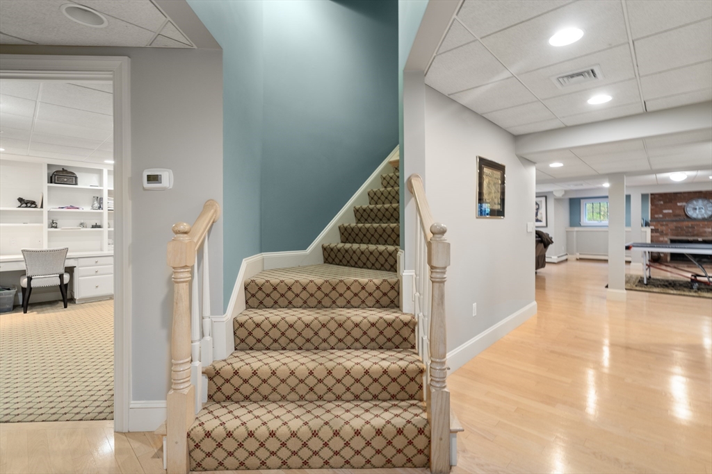 137 Lake Street Sherborn, MA 01770 - Photo 26 of 42 a view of a hallway with furniture and floor to ceiling window