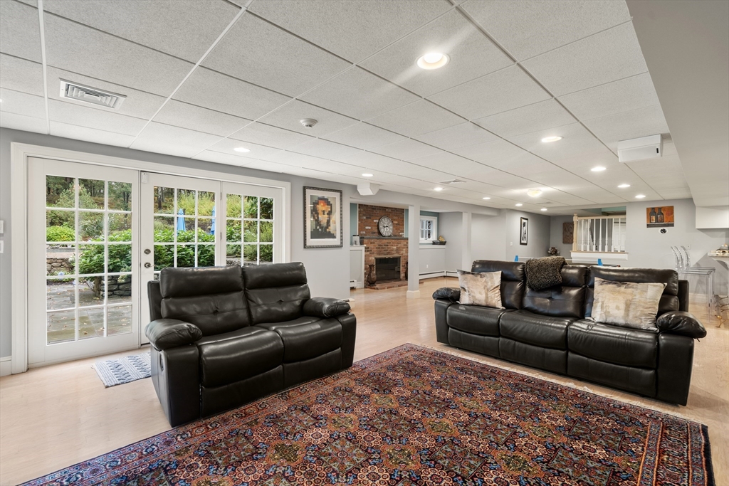 137 Lake Street Sherborn, MA 01770 - Photo 27 of 42 a living room with furniture and a large window