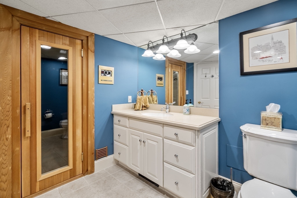 137 Lake Street Sherborn, MA 01770 - Photo 30 of 42 a bathroom with a sink and a mirror