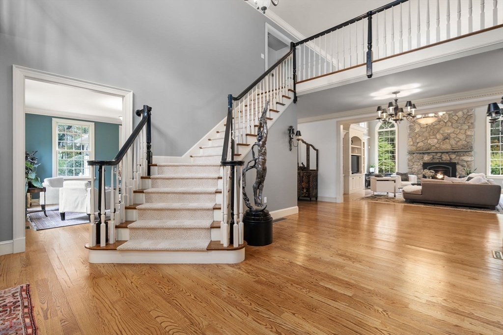 137 Lake Street Sherborn, MA 01770 - Photo 4 of 42 a view of staircase and living room with wooden floor
