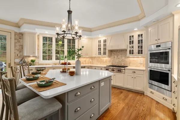 a kitchen with a stove a sink and a refrigerator