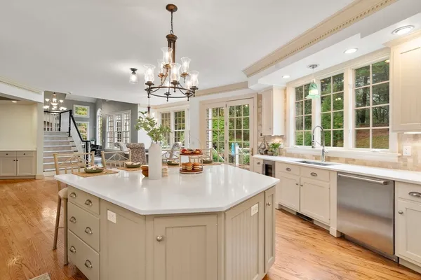 a kitchen with center island and windows