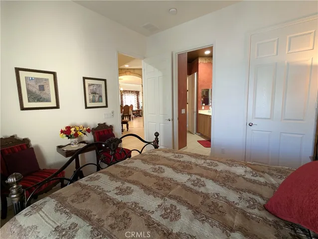 a bedroom with a bed and furniture