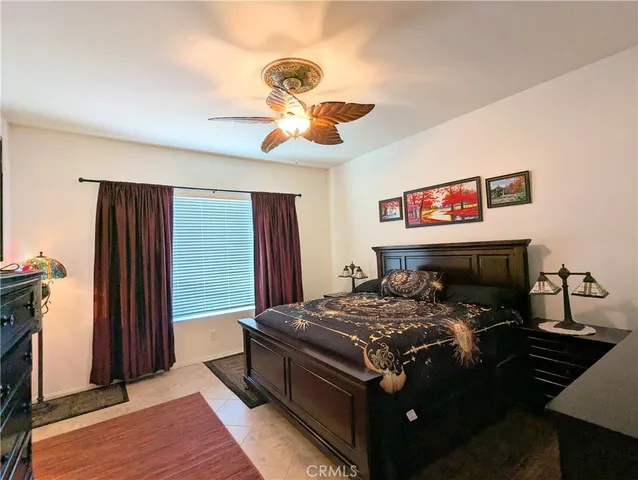 a bed sitting in a room next to a window