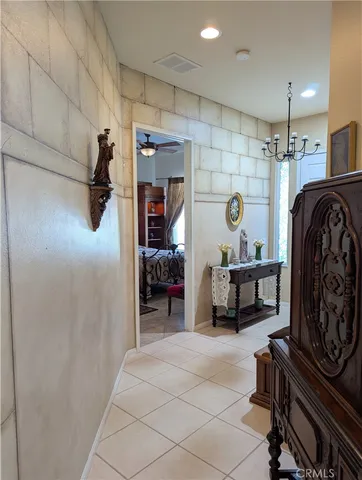 a bedroom with furniture and a mirror