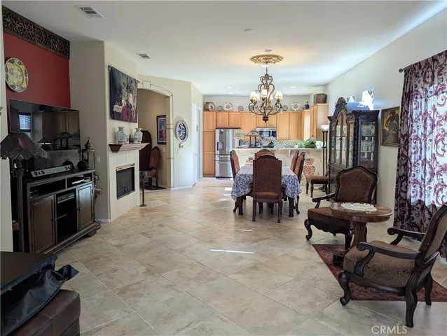 a view of a livingroom with furniture and a kitchen