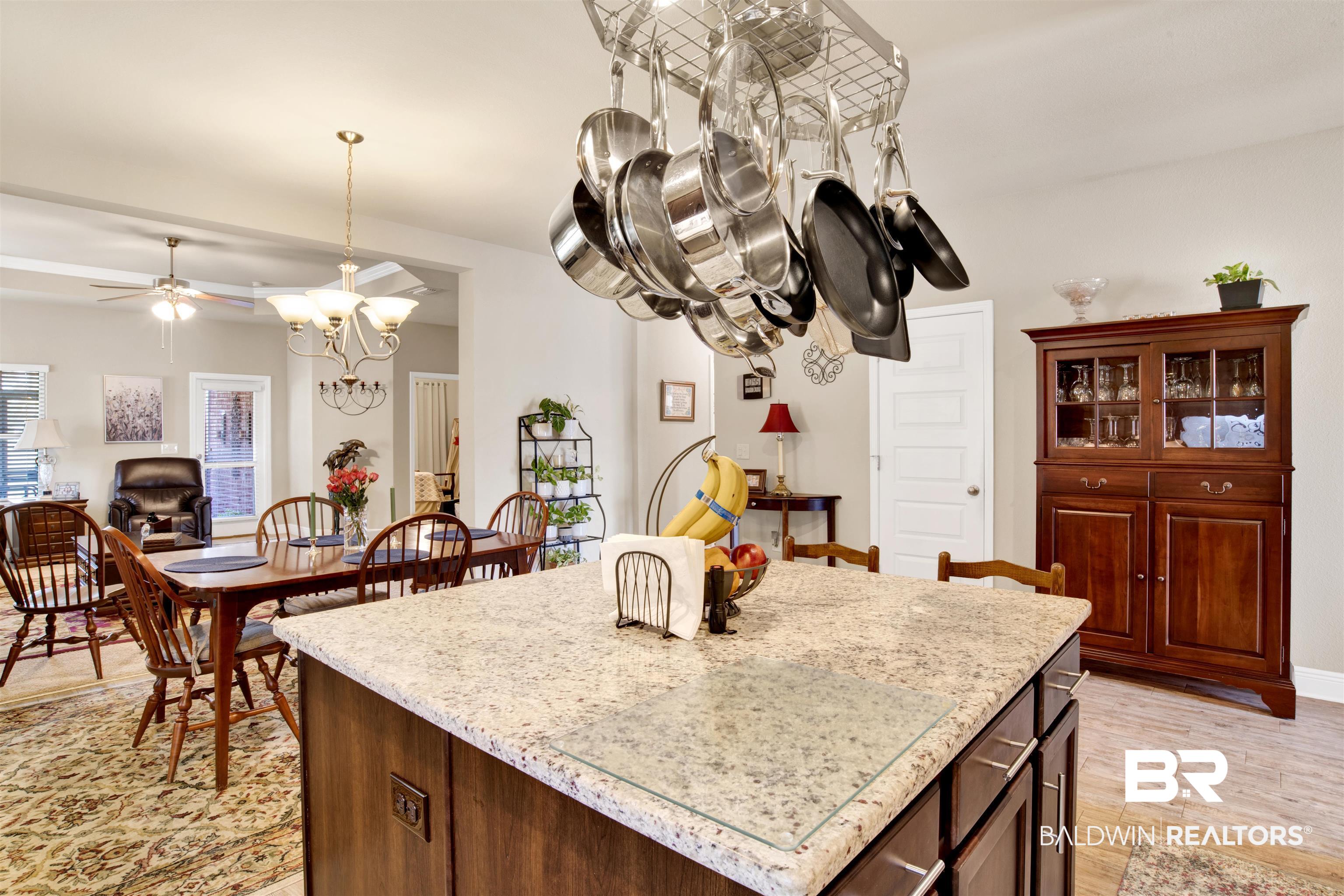 1476 Surrey Loop Foley, AL 36535 - Photo 12 of 31 Kitchen with decorative light fixtures, a center island, ceiling fan with notable chandelier, and light hardwood / wood-style flooring