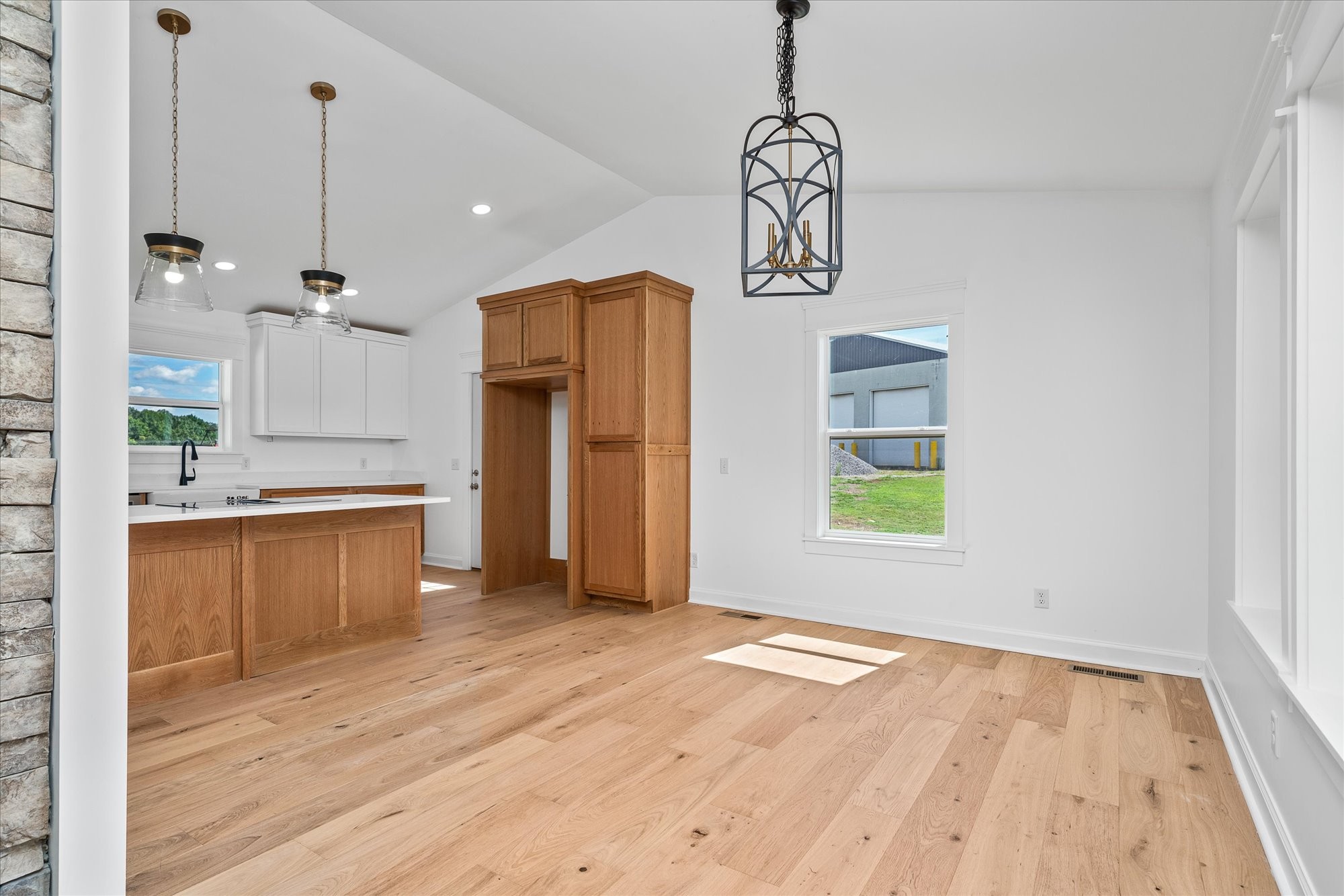 806 Robinson Ridge Road Baxter, TN 38544 - Photo 11 of 36 a view of a kitchen with a sink and dishwasher a refrigerator with wooden floor