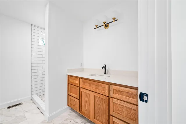 a kitchen with a sink and cabinets