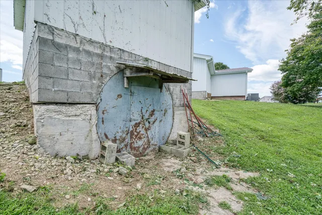 a view of a tiny house with a yard
