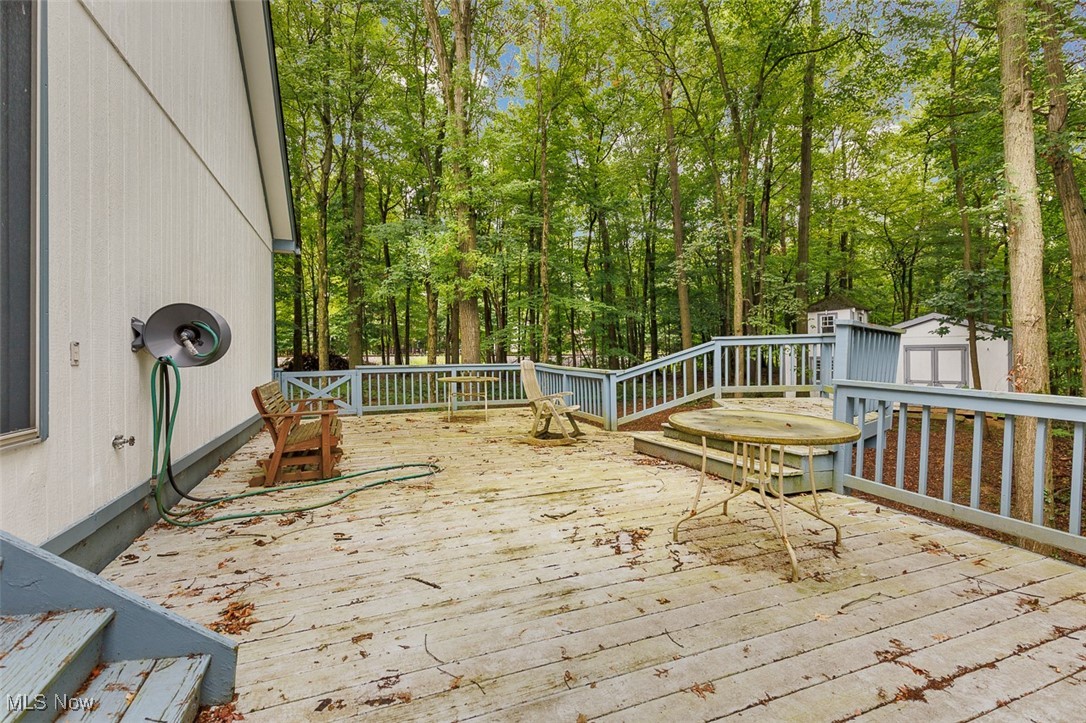 10024 Fair Road Strongsville, OH 44149 - Photo 36 of 41 Wooden deck with a storage shed