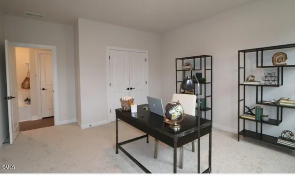 a room that has a table and chairs in it