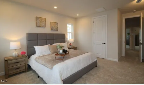 a bed room with a bed and a night stand