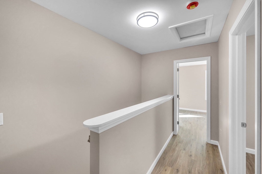 121-123 Putnam Circle Springfield, MA 01104 - Photo 11 of 18 a view of hallway with wooden floor