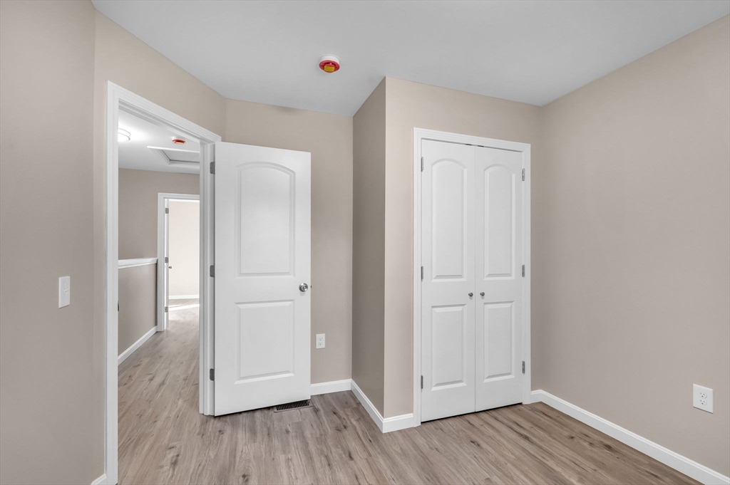 121-123 Putnam Circle Springfield, MA 01104 - Photo 13 of 18 wooden floor in an empty room