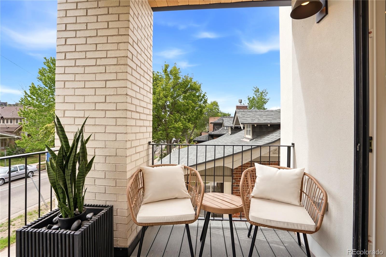 245 South Emerson Street Denver, CO 80209 - Photo 35 of 49 a balcony with table and chairs