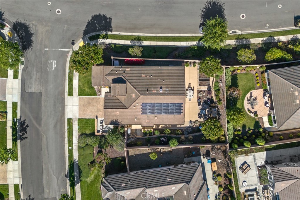 1147 Contessa Way Nipomo, CA 93444 - Photo 39 of 57 an aerial view of a house with a yard potted plants and large tree