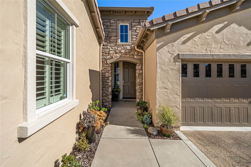 1147 Contessa Way Nipomo, CA 93444 - Photo 4 of 57 a front view of a house with a yard