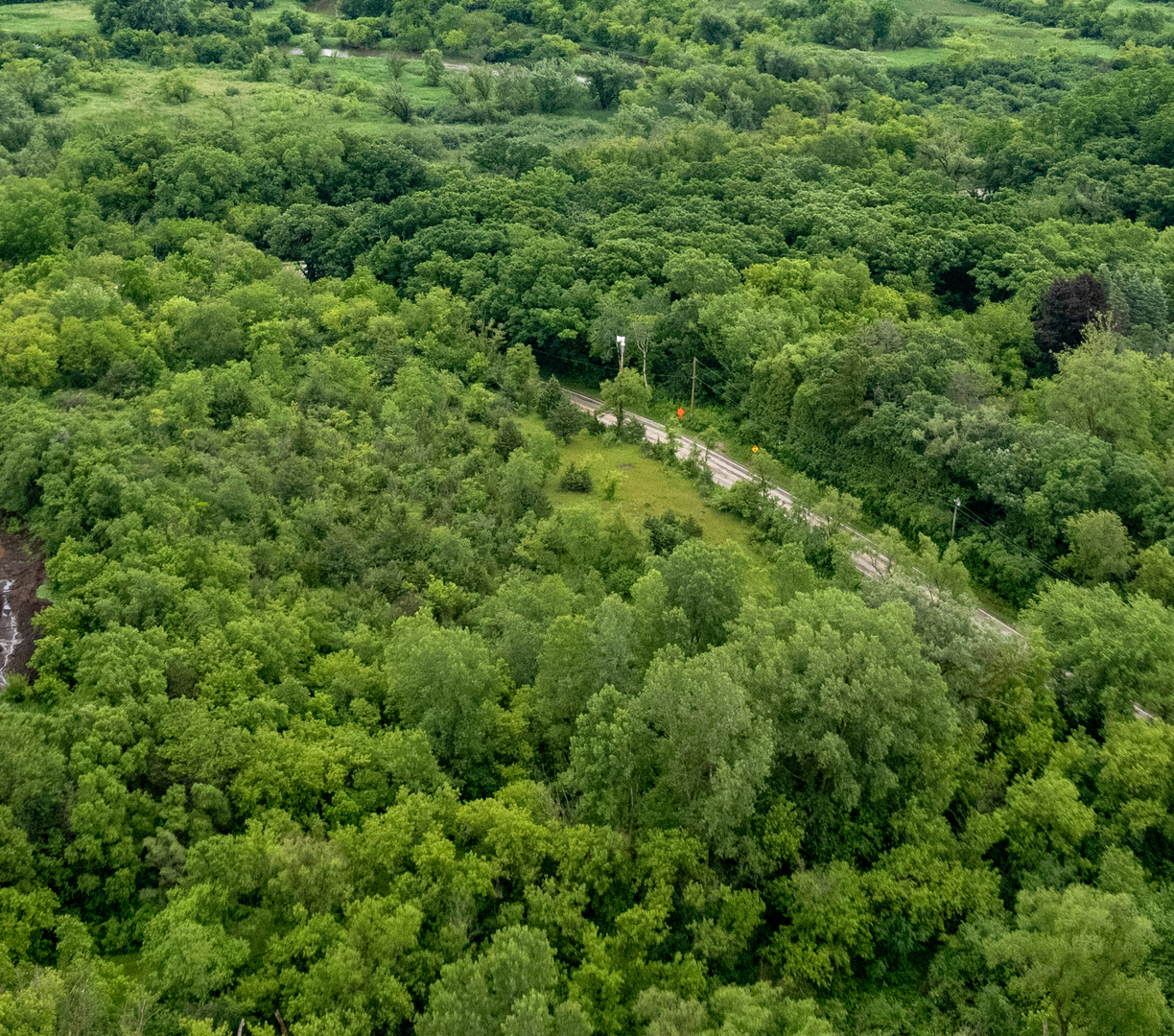Lot 0 Sunset Road Spring Grove, IL 60081 - Photo 7 of 10 an aerial view of residential house with outdoor space and trees all around