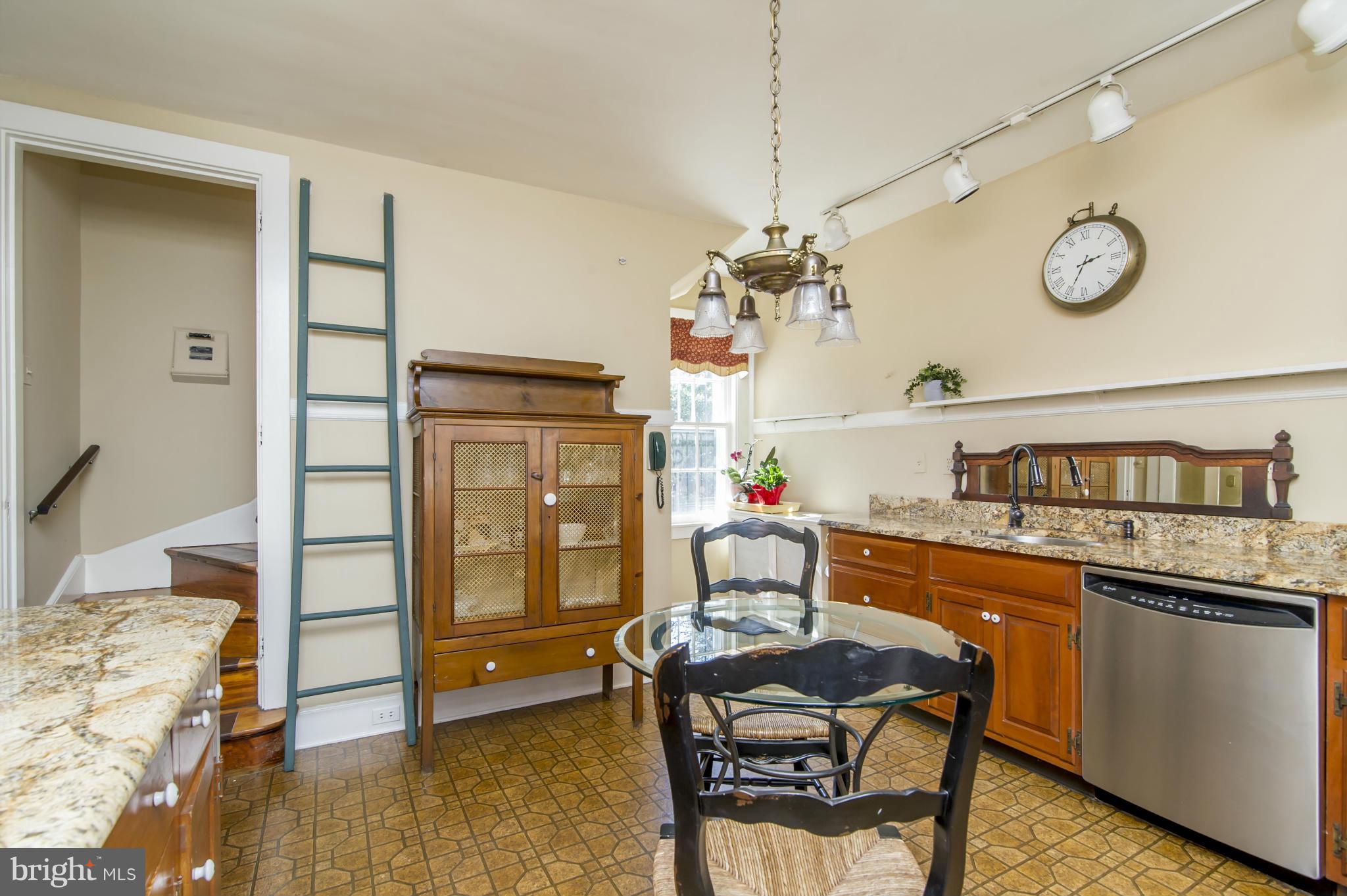 100 Millbrook Road Baltimore, MD 21218 - Photo 15 of 28 Kitchen w/ back stairs to 2nd floor