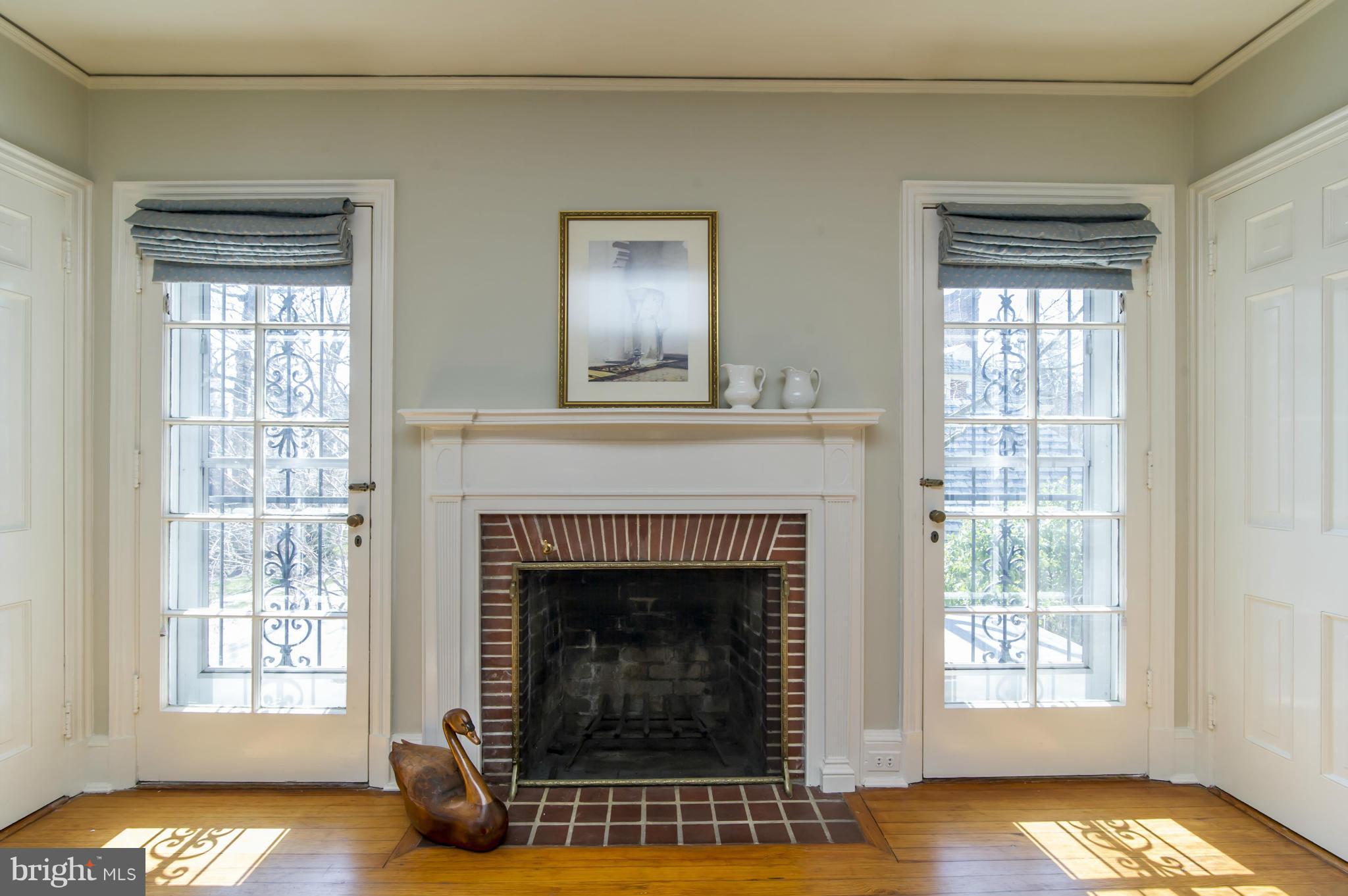 100 Millbrook Road Baltimore, MD 21218 - Photo 17 of 28 Master Bedroom w/ wood burning fireplace