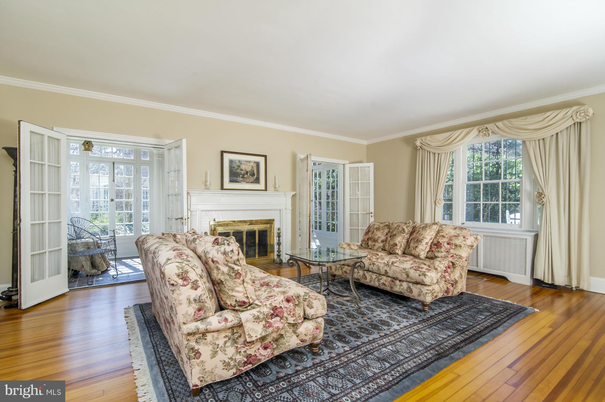 100 Millbrook Road Baltimore, MD 21218 - Photo 6 of 28 Living Room opens to Sunroom