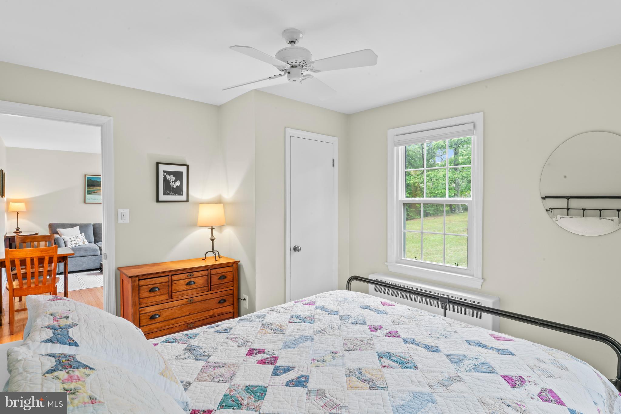 12131 Waples Mill Road Oakton, VA 22124 - Photo 8 of 40 a bedroom with a bed dresser and a window