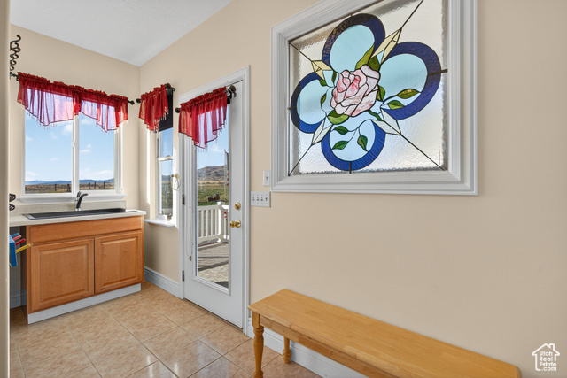 4768 East Hickman Canyon Road Stockton, UT 84071 - Photo 4 of 85 Doorway featuring tile patterned floors and a sink.