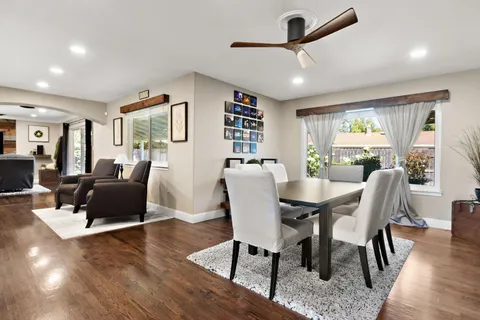 a view of a livingroom with furniture window and wooden floor