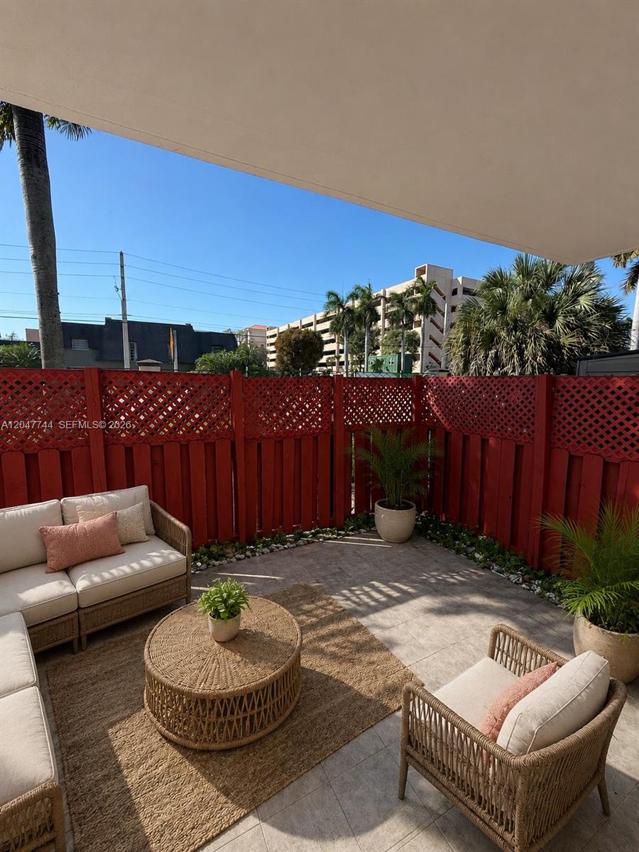 8601 Southwest 94th Street, Unit 105W Miami, FL 33156 - Photo 18 of 24 Fenced Patio looking at Baptist Hospital, staged