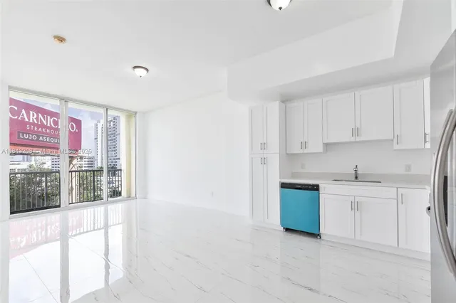 a kitchen with stainless steel appliances granite countertop a stove and a sink