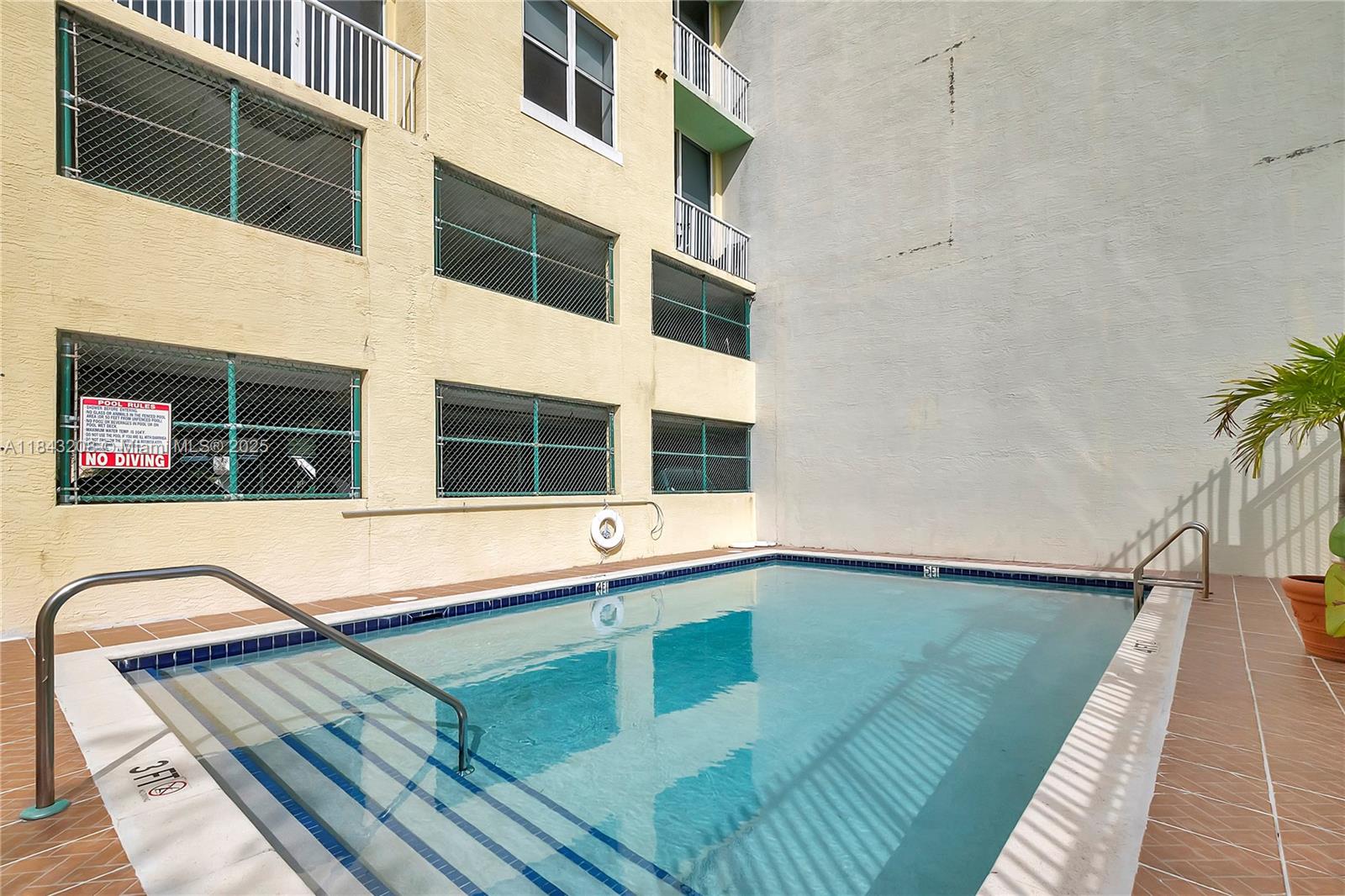 1350 Northwest 8th Court, Unit B5 Miami, FL 33136 - Photo 15 of 21 a view of an buildings with swimming pool